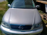 Second-hand Opel Omega 144 CP (105 kW) 2000 Argintiu Berlinǎ