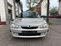 Second-hand Mazda 323 88 CP (64 kW) 1999 Gri Berlinǎ