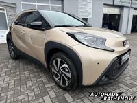 Gebraucht Toyota Aygo X Pulse 72 PS (52 kW) 2024 Ginger beige (4u9)/ black mica SUV