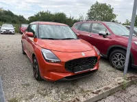Gebraucht Suzuki Swift Comfort+ 83 PS (61 kW) 2024 Flame orange pearl metallic Kleinwagen