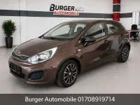 Używany Kia Rio Attract 86 KM (63 kW) 2012 Brązowy Sedan/Limuzyna
