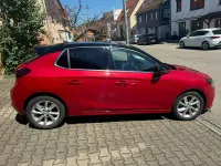 Używany Opel Corsa Elegance 101 KM (74 kW) 2023 Czerwony Hatchback