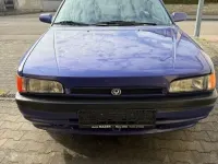 Używany Mazda 323 54 KM (39 kW) 1994 Niebieski Sedan/Limuzyna
