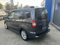 Gebraucht Ford Tourneo Courier 101 PS (74 kW) 2015 Grau (magneticgrau) Van / Kleinbus