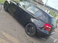 Gebraucht BMW 116 122 PS (89 kW) 2010 Schwarz Kleinwagen