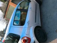 Usado Renault Modus 75 CV (55 kW) 2006 Plateado Monovolumen