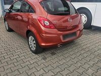 Second-hand Opel Corsa 100 CP (73 kW) 2012 Portocaliu Hatchback