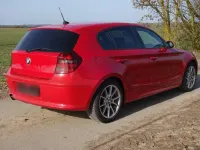 Używany BMW 116 122 KM (89 kW) 2009 Czerwony Hatchback