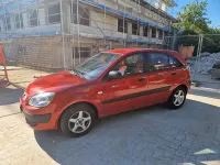 Używany Kia Rio 96 KM (70 kW) 2009 Czerwony Sedan/Limuzyna