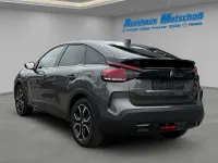 Gebraucht Citroën e-C4 Shine 100 kW (136 PS) 2023 Lackierung platiniumgrau/typ Limousine