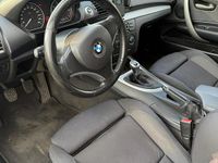 Second-hand BMW 116 122 CP (89 kW) 2007 Negru Hatchback