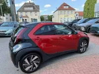 Gebraucht Toyota Aygo X X-plore 72 PS (52 kW) 2023 Chili red/ black mica SUV