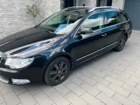 Używany Skoda Superb 170 KM (125 kW) 2012 Czarny Kombi