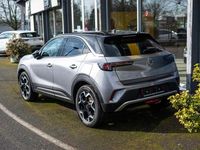 Gebraucht Opel Mokka-e Ultimate 100 kW (136 PS) 2023 Kontrast grau metallic SUV
