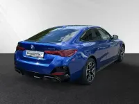 Gebraucht BMW i4 M Sport 294 kW (401 PS) 2025 Portimao blau metallic Limousine