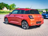Gebraucht Suzuki Swift Comfort+ 83 PS (61 kW) 2024 Flame orange pearl metallic Kleinwagen