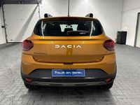 Gebraucht Dacia Sandero Expression 91 PS (66 kW) 2023 Orange (taklamakanorange met.) Kleinwagen