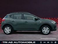 Gebraucht Dacia Sandero Expression 101 PS (74 kW) 2024 Safarigrüngrau Kleinwagen