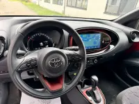 Gebraucht Toyota Aygo X X-plore 72 PS (52 kW) 2024 Chili red (3u4)/ black mica (2 SUV