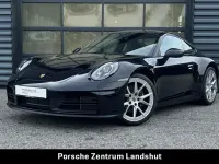Gebraucht Porsche 911 Carrera 394 PS (289 kW) 2025 Tiefschwarzmetallic Coupé