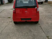 Gebraucht Daihatsu Cuore 58 PS (42 kW) 2004 Rot Kleinwagen