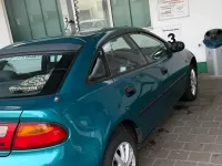 Second-hand Mazda 323F 88 CP (64 kW) 1995 Verde Berlinǎ