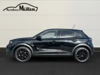Gebraucht Opel Mokka-e GS Line 100 kW (136 PS) 2024 Lackierung schwarz perla nera/ SUV