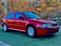 Używany Skoda Octavia 110 KM (80 kW) 2004 Czerwony Sedan/Limuzyna