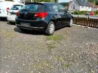 Używany Opel Astra 101 KM (74 kW) 2015 Czarny Sedan/Limuzyna
