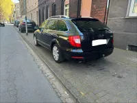 Używany Skoda Superb 140 KM (102 kW) 2012 Czarny Kombi