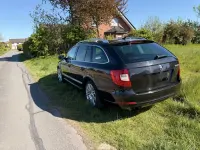 Używany Skoda Superb Elegance 170 KM (125 kW) 2012 Czarny Kombi