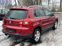 Second-hand VW Tiguan Team 122 CP (89 kW) 2010 Roșu SUV