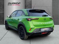 Gebraucht Opel Mokka-e 100 kW (136 PS) 2023 Matcha green/ikone gruen SUV