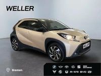 Gebraucht Toyota Aygo 72 PS (52 kW) 2024 Ginger beige / night sky black Kleinwagen