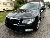 Używany Skoda Superb 140 KM (102 kW) 2012 Czarny Kombi