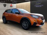 Second-hand Peugeot e-2008 Active 100 kW (136 CP) 2022 Portocaliu SUV