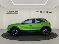 Gebraucht Opel Mokka Elegance 101 PS (74 kW) 2024 Lackierung matcha green/typ aussenverkle (metallic) SUV