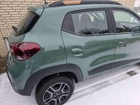 Gebraucht Dacia Spring Extreme 47 kW (65 PS) 2023 Grün "flechtengrau" Kleinwagen