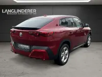 Gebraucht BMW X2 Sport Line 156 PS (114 kW) 2024 Dragon fire rot metallic SUV