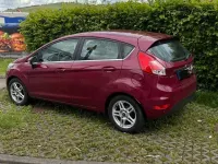 Używany Ford Fiesta Titanium 101 KM (74 kW) 2013 Czerwony Sedan/Limuzyna