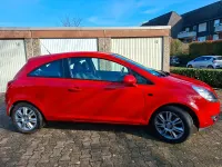 Używany Opel Corsa 60 KM (44 kW) 2009 Czerwony Hatchback