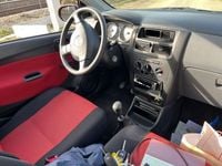 Gebraucht Daihatsu Cuore 58 PS (42 kW) 2007 Rot Kleinwagen