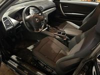 Second-hand BMW 116 122 CP (89 kW) 2009 Negru Hatchback