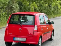 Gebraucht Daihatsu Cuore 60 PS (44 kW) 2004 Rot Kleinwagen