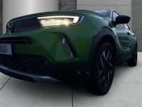 Gebraucht Opel Mokka-e Elegance 100 kW (136 PS) 2023 Matcha green/ikone gruen SUV