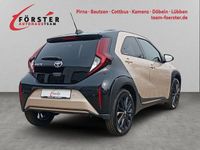 Gebraucht Toyota Aygo X Style 72 PS (52 kW) 2022 Ginger beige metallic/ night sky black SUV