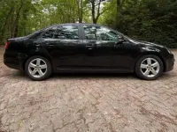 Gebraucht VW Jetta 105 PS (77 kW) 2008 Schwarz Limousine
