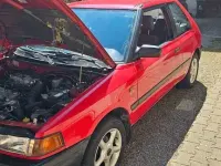 Gebraucht Mazda 323 73 PS (53 kW) 1992 Rot Kleinwagen