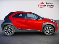 Gebraucht Toyota Aygo X Pulse 72 PS (52 kW) 2023 Chili red perleffekt/ night sky black SUV