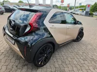 Gebraucht Toyota Aygo X x-style 72 PS (52 kW) 2022 Ginger beige metallic/ night sky black SUV
